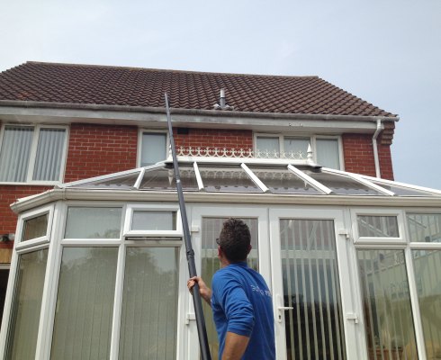 Gutter cleaning Norwich - house with conservatory